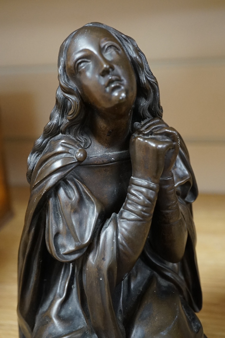 An early to mid 20th century bronze figure of Mary Magdalene kneeling, 20cm. Condition - good